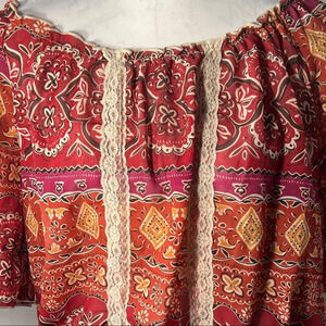 Lilly Lou top sz Lg. elastic and ruffled neckline and drop waist line